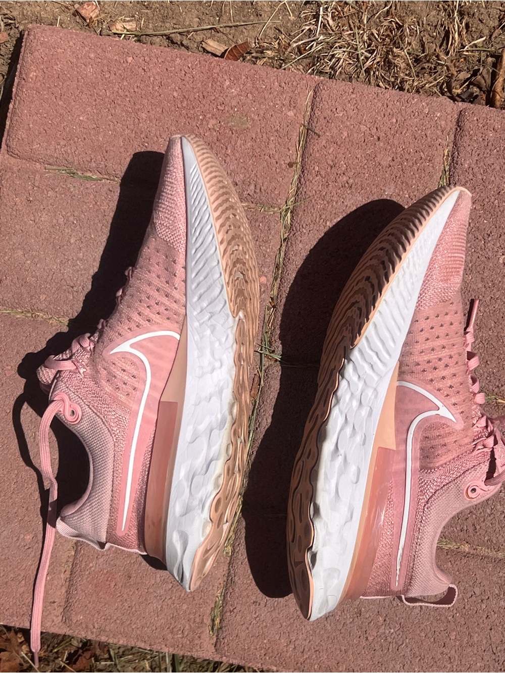 Nike Women's Pink Running Shoes with White Swoosh